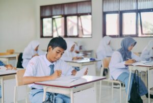 High school students in Indonesia studying in a classroom setting.