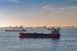 Cargo ships and oil tankers on the Bosporus strait, capturing global trade and maritime logistics at sunset.